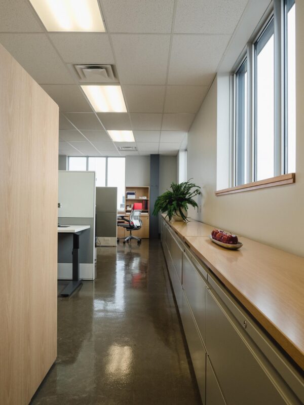 View of corridor with file cabinets and work stations
