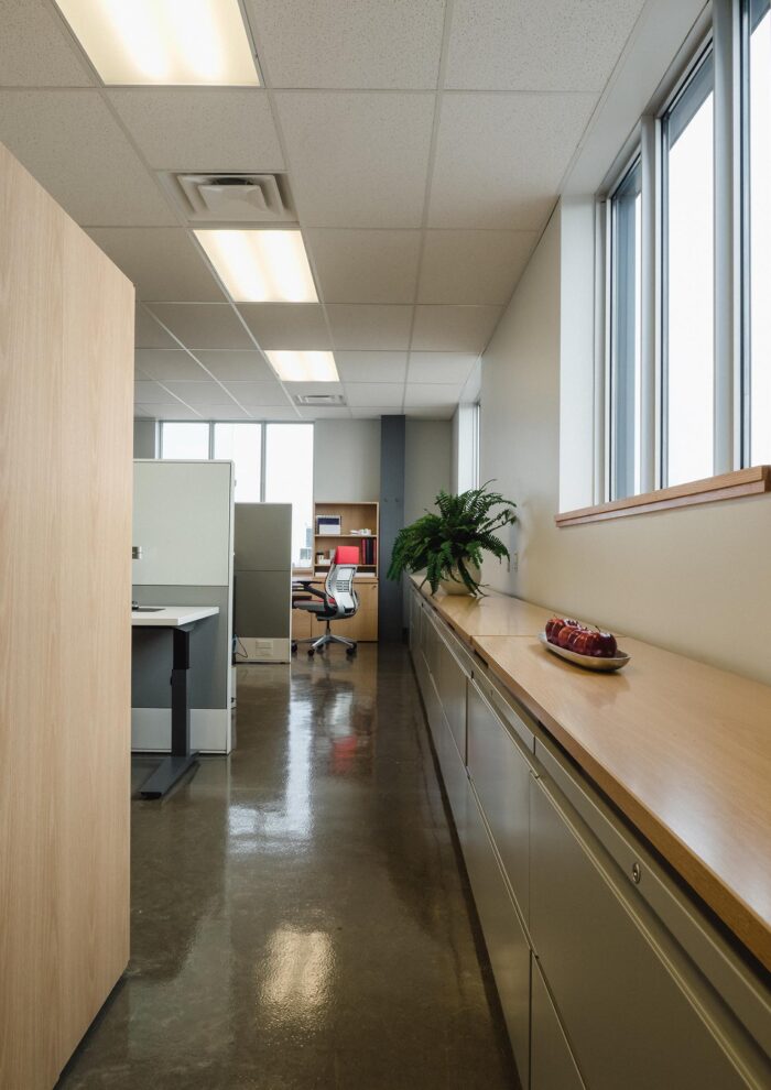 View of corridor with file cabinets and work stations