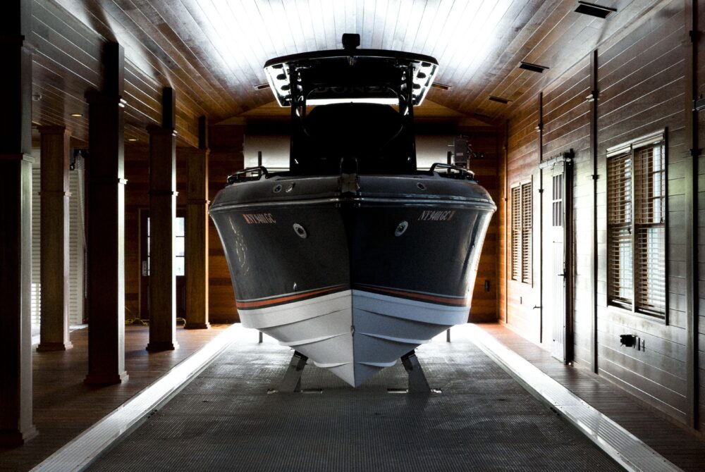 Custom boathouse exterior with boat slips and living quarters – 1000 Islands