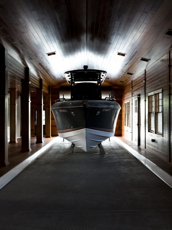 Custom boathouse exterior with boat slips and living quarters – 1000 Islands