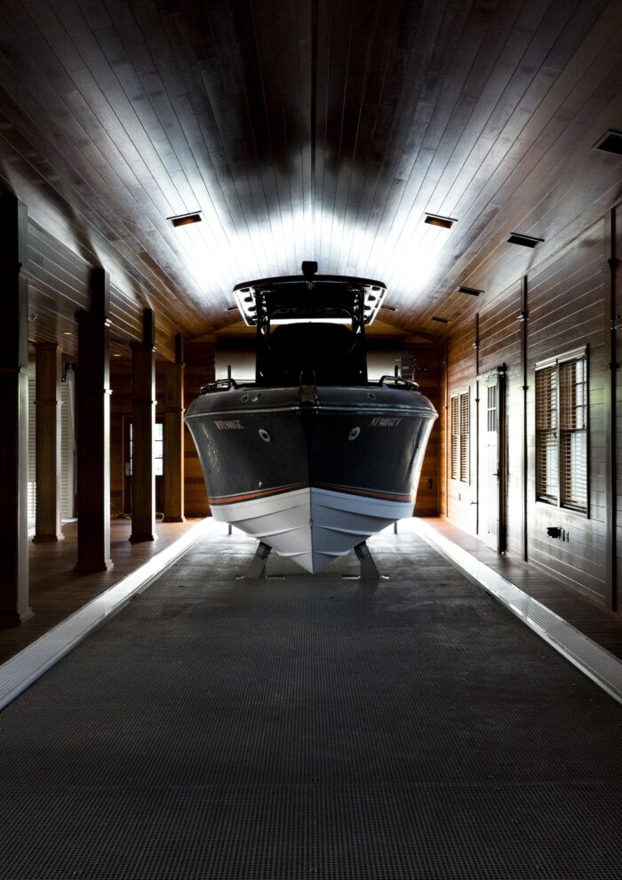 Custom boathouse exterior with boat slips and living quarters – 1000 Islands