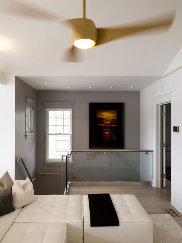 Open-plan boathouse interior with large windows and modern detailing