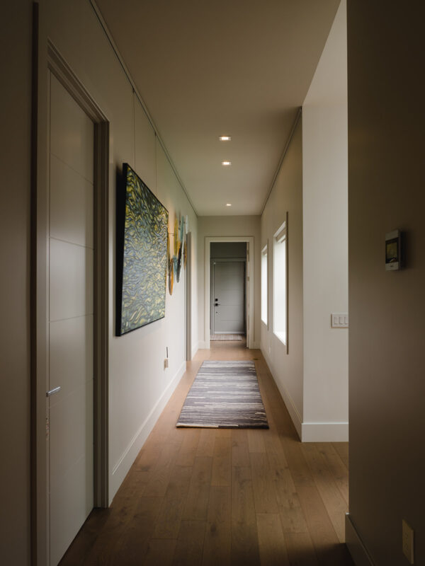 hallway with art and large windows