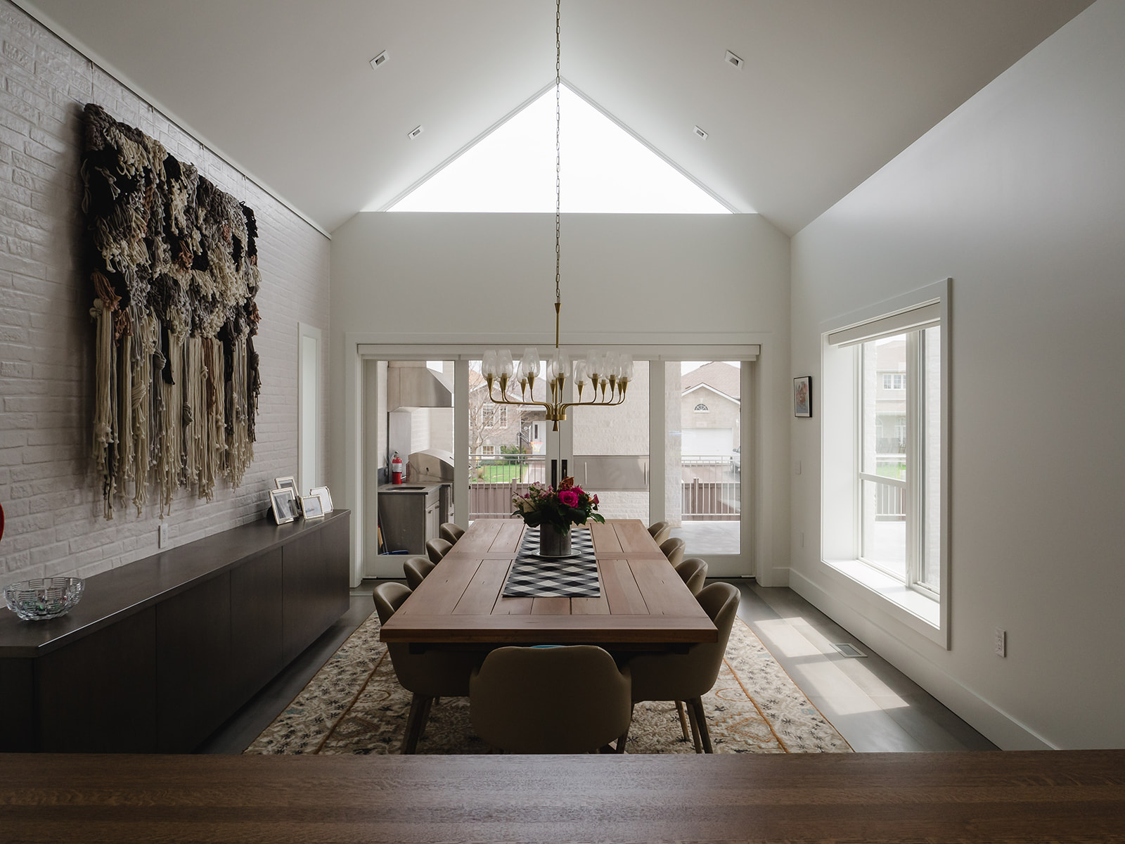 Open-concept dining room in custom Kingston home with modern detailing