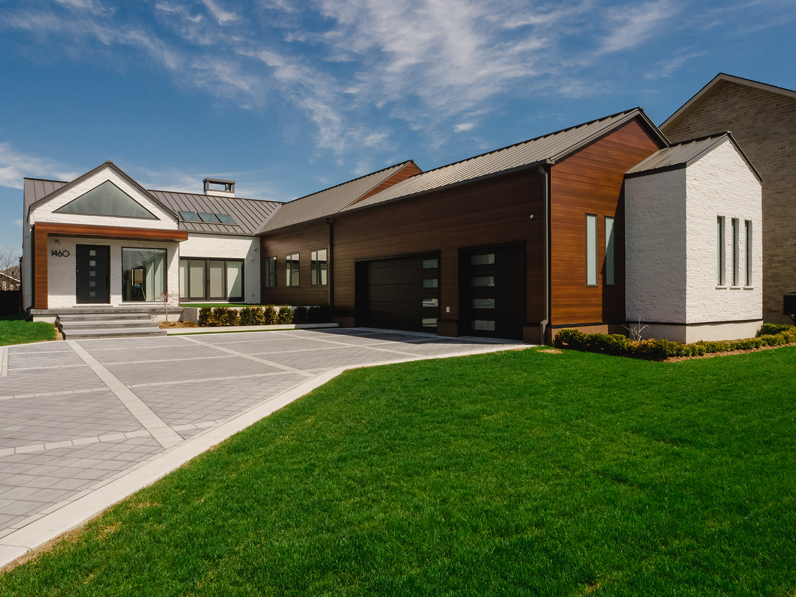 Contemporary suburban home with front courtyard and private rear yard