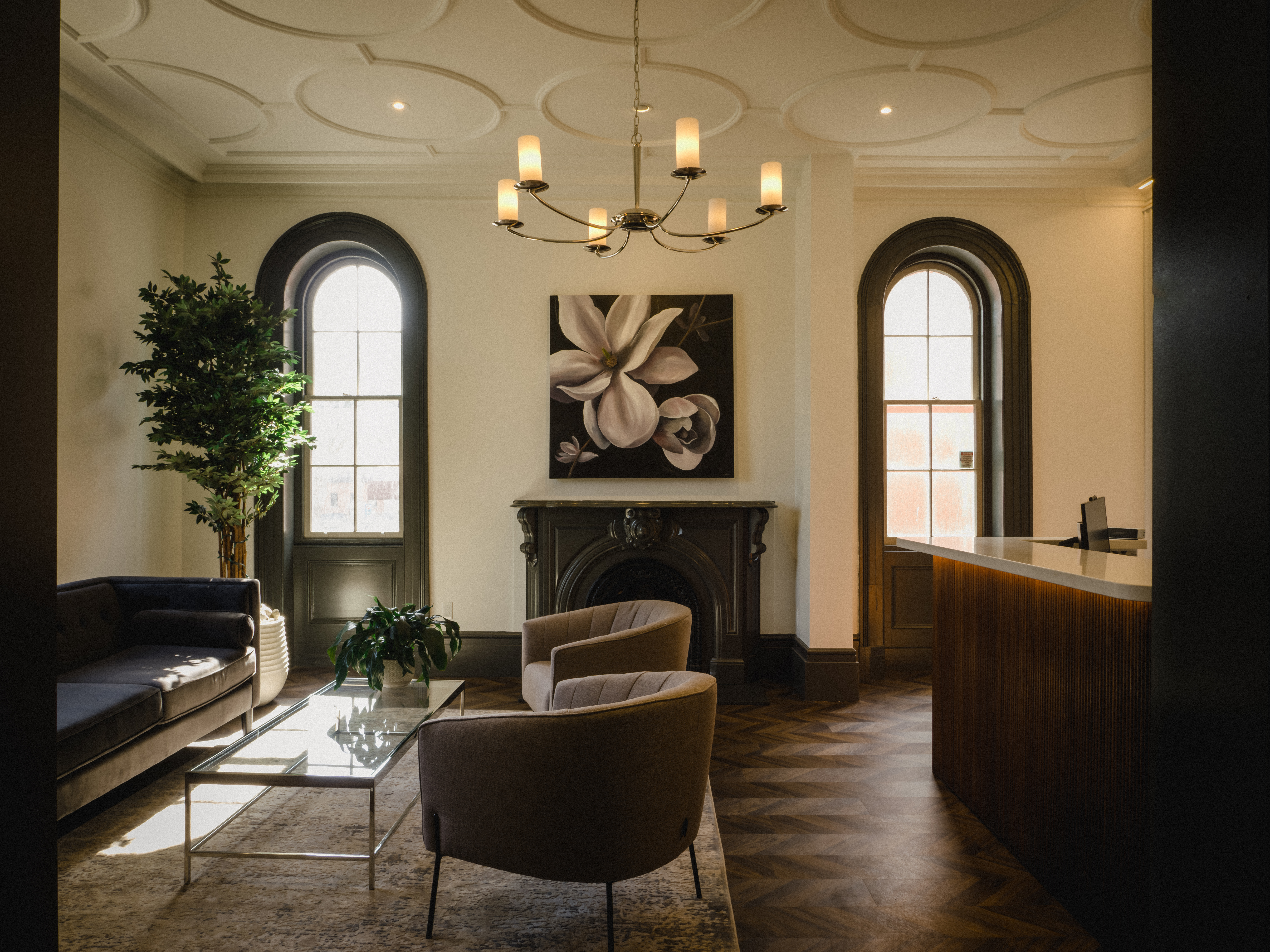 Reception area featuring custom millwork and original plaster mouldings
