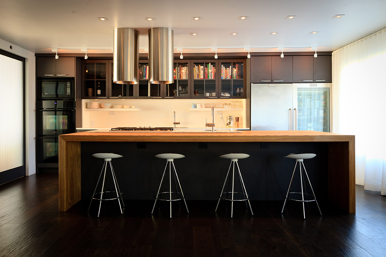 Contemporary kitchen interior with warm oak accents and minimalist detailing