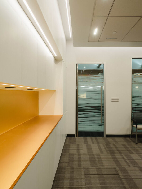 Branded millwork with integrated lighting.